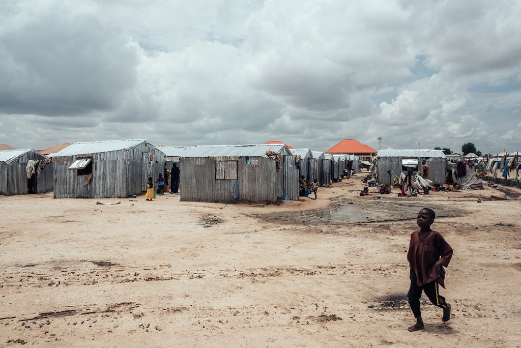 A child walks past shelters in a displacement camp in Maiduguri, the capital of Borno State in northeast Nigeria.