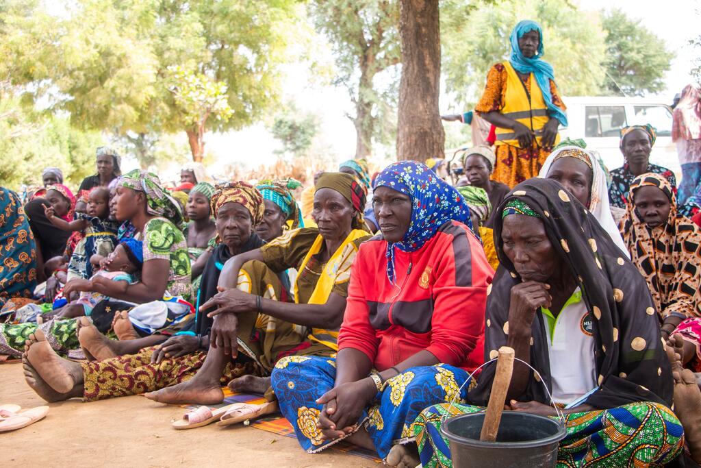 A group of local women and children in Yagoua, Cameroon, participate in a sensitization event for the PULCCA project, aimed at combating food insecurity and strengthening community resilience.