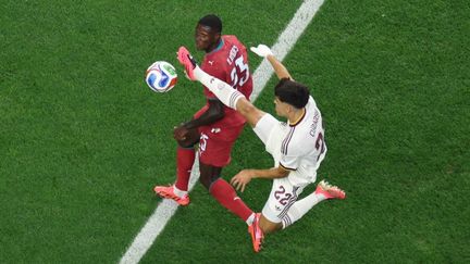 Portuguese defender Nuno Mendes challenges Spanish player in World Cup eighth-final