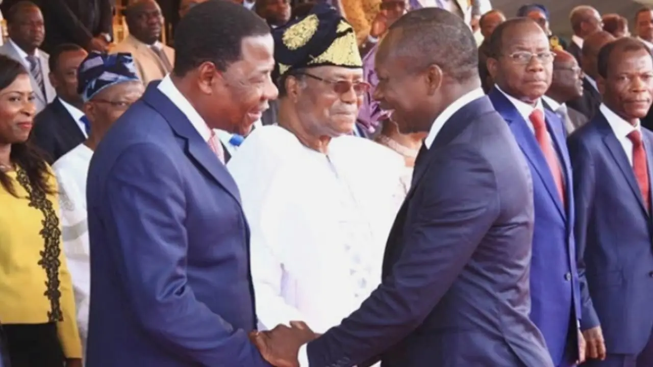 Presidents Nicéphore Soglo (in background), Boni Yayi (left), and Patrice Talon (right)
