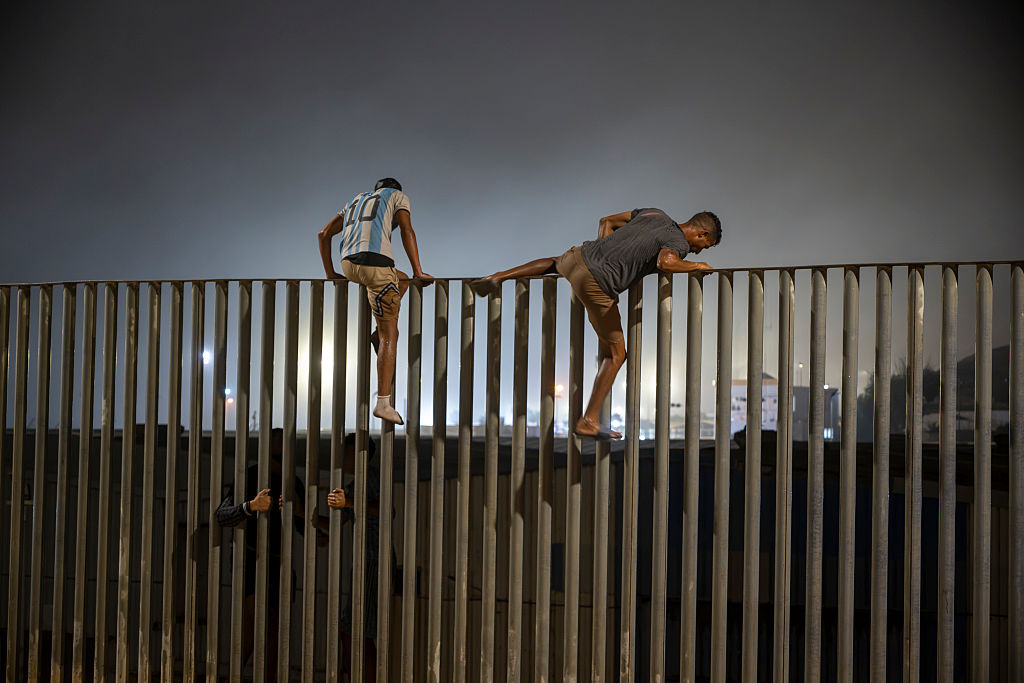 Migrants arriving at Ceuta border crossing