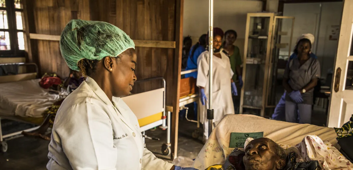 Health workers in protective gear attending to patients during the Ebola outbreak in Democratic Republic of Congo